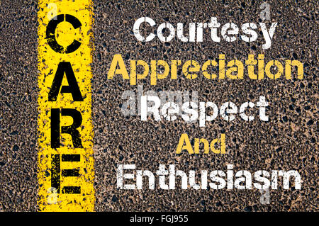 Concept image of Business Acronym CARE Courtesy Appreciation Respect And Enthusiasm written over road marking yellow paint line Stock Photo