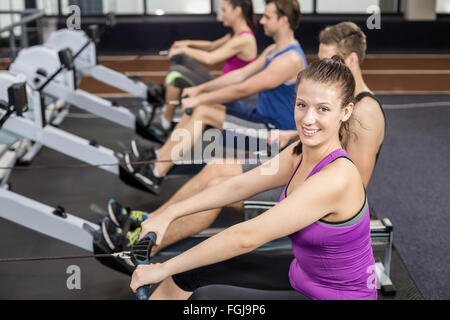 Fit people on drawing machine Stock Photo