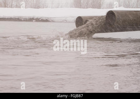 Dirty water discharged into the river, pollution Stock Photo