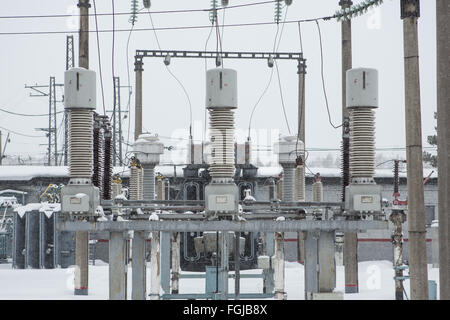 High voltage electric power substation in winter day Stock Photo