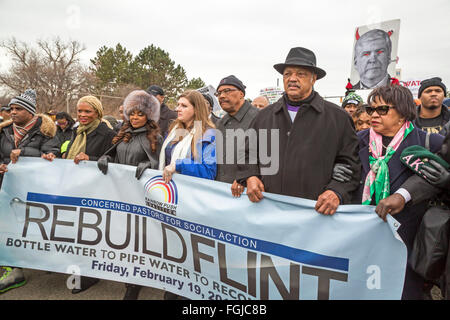 Flint, Michigan USA - 19th February 2016 - Residents marched to the Flint water treatment plant to demand the rebuilding of the city's water infrastructure. The march was led by Rev. Jesse Jackson (right, wearing hat). Credit:  Jim West/Alamy Live News Stock Photo