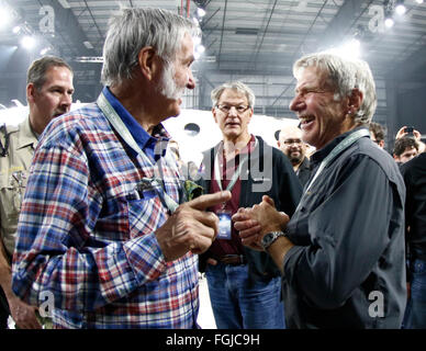 Mojave, California, USA. 19th February, 2016. L-R) Aviation pioneer Burt Rutan talks with actor Harrison Ford, during the Virgin Galactic roll out of a new version of its SpaceShipTwo space tourism rocket Friday as it prepares to return to flight testing for the first time since a 2014 accident destroyed the original, killed one of its pilots and set back the nascent industry.The space line founded by Sir Richard Branson unveils the craft at California's Mojave Air & Space Port, where it was assembled. Credit:  ZUMA Press, Inc./Alamy Live News Stock Photo