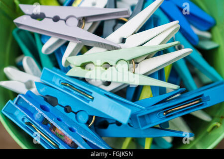 A bunch of plastic coloured clothes pegs Stock Photo