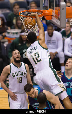 Milwaukee Bucks forward Jabari Parker, left, drives to the basket past ...