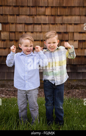 Two brothers together outdoors in a lifestyle portrait with natural light. Stock Photo