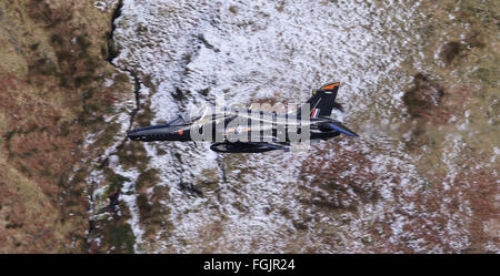 An RAF HAWK T2 training  jet exiting the Mach Loop at high speed and low altitude Stock Photo