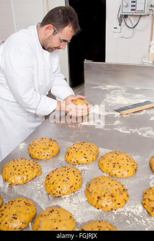 Pastry Chef, prepares dough to make the cake panettone Stock Photo