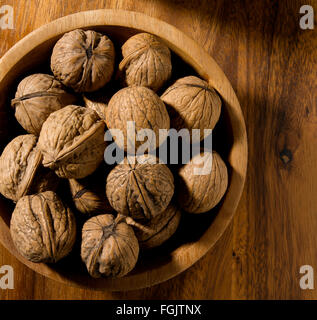 Walnut isolated in bowl on tabletop Stock Photo