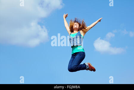 young woman jumping Stock Photo