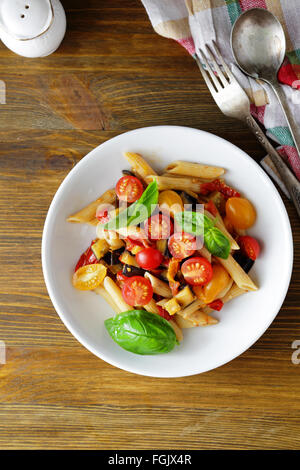 pasta penne with roasted vegetables, food top view Stock Photo