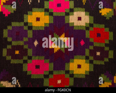 Close up Old traditional Romanian wool carpet with ancient motifs Stock Photo
