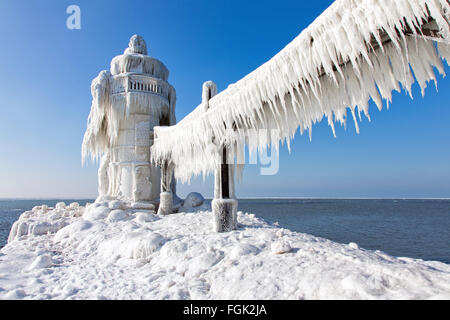 St. Joseph Michigan Lighthouse. North Pier outer lighthouse in St. Joseph Michigan encased in ice in winter Stock Photo