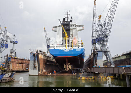 Container ship in a repair dock Stock Photo