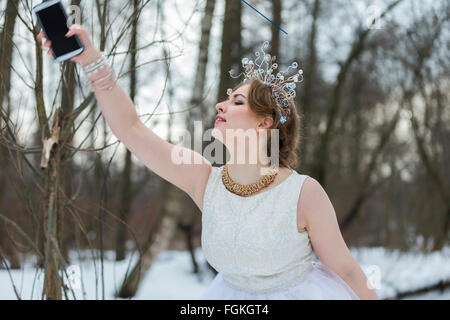 Young emotional woman making selfie on the street. Stock Photo