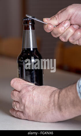 Bottle opener on a class beer bottle Stock Photo