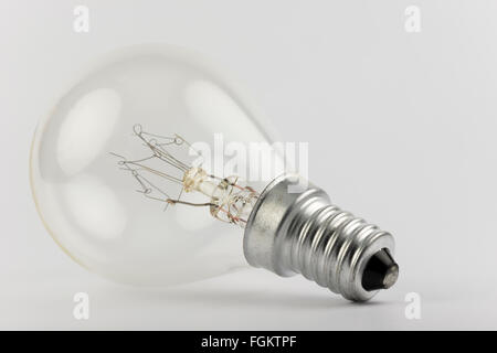 Old light bulb with artfully shaped filaments Stock Photo