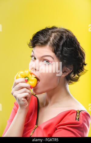 Girl with yellow sweet pepper Stock Photo