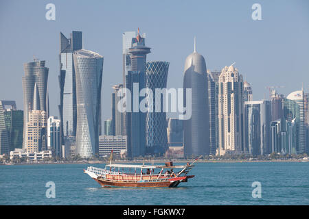 Doha Financial District skyline view with Dhow boat in foreground. Stock Photo