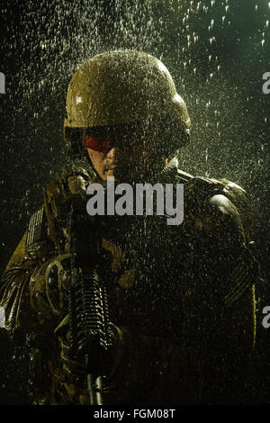 US Army soldier in the rain Stock Photo