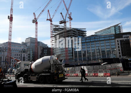 Deloitte headquarters new Shoe Lane building and Goldman Sachs construction site cranes on Farringdon Street in the City of London UK  KATHY DEWITT Stock Photo