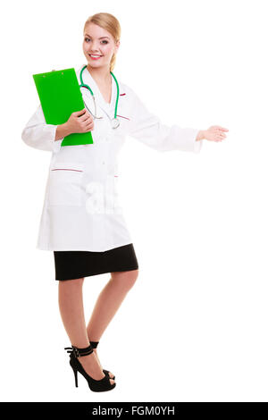 Full length of woman in white lab coat with stethoscope inviting making welcome hand gesture. Doctor with clipboard isolated. Stock Photo