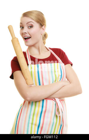 Happy housewife or baker chef wearing kitchen apron holds baking rolling pin studio picture isolated on white Stock Photo