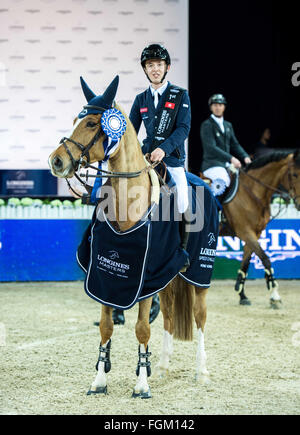 Hong Kong, Hong Kong SAR, China. 20th Feb, 2016. Irish rider BERTRAM ALLEN wins the Longines Masters Hong Kong Speed challenge taking 1st from the hands of legendary British rider John Whitaker.The Asian leg of the Grand Slam Indoor of Show Jumping brings the worlds elite equestrian riders from 27 countries to Hong Kong to for a 3 day events. Allen is on his winning horse, ''Quiet Easy 4' © Jayne Russell/ZUMA Wire/Alamy Live News Stock Photo