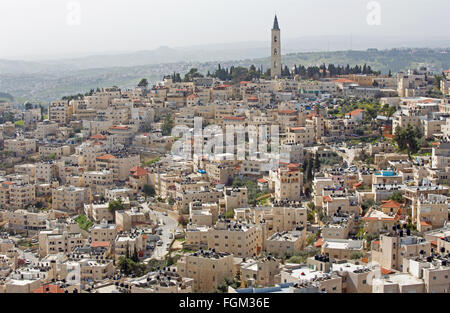 Jerusalem - The Russian orthodox church of Ascension on the Mount of Olives and the ruins of Herodion on the horizon. Stock Photo
