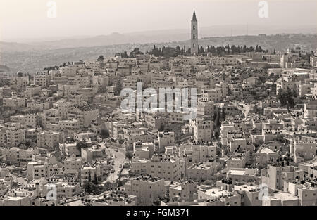 Jerusalem - The Russian orthodox church of Ascension on the Mount of Olives and the ruins of Herodion on the horizon. Stock Photo