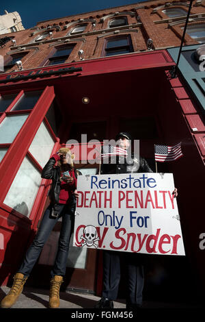 Ann Arbor, MI, USA. 20th Feb, 2016. Egypt Landii, left, and Ray Lewis protest on Main Street in downtown Ann Arbor, MI on Feb 20, 2016. Michigan governor Rick Snyder has been taking heavy criticism for his handling of the Flint water crisis. © Mark Bialek/ZUMA Wire/Alamy Live News Stock Photo