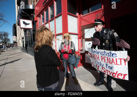 Ann Arbor, MI, USA. 20th Feb, 2016. Egypt Landii, left, and Ray Lewis protest on Main Street in downtown Ann Arbor, MI on Feb 20, 2016. Michigan governor Rick Snyder has been taking heavy criticism for his handling of the Flint water crisis. © Mark Bialek/ZUMA Wire/Alamy Live News Stock Photo