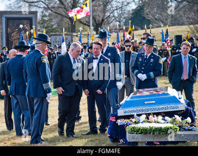 Feb. 20, 2016 - Timonium, Maryland, U.S. - February 20, 2016 : Maryland Governor Larry Hogan, 3rd from left, talks with Harford County Executive Barry Glassman as they view a specially made burial vault top before the funeral for Harford County Deputy First Class Mark Logsdon at Dulaney Valley Memorial Gardens in Timonium, Maryland. This was the second of two funeral for the deputies killed on February 10th in an incident that started at a Panera bread location in Abingdon, Maryland. These were the first police deaths by gunfire for the Harford County Sheriff's Office since 1899. Scott Serio/E Stock Photo