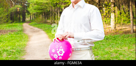 A man holding a balloon Stock Photo