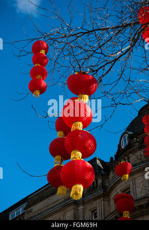 Red lanterns decorate the trees in Manchester City Centre to celebrate Chinese New Year Stock Photo