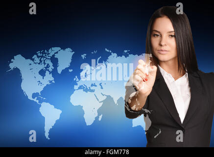 Woman in suit drawing on world map virtual space