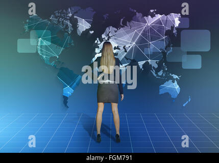 Girl stands in front of the network world map Stock Photo