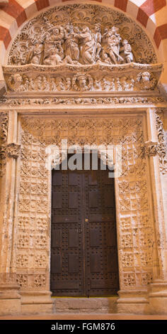 CORDOBA, SPAIN - MAY 28, 2015: The little late gothic portal in the Cathedral with the Arresting of Christ in Gethsemane garden Stock Photo