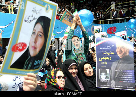 Tehran, Iran. 20th Feb, 2016. Iranian women hold up posters during a reformists campaign meeting in Tehran, capital of Iran, on Feb. 20, 2016. Iranian hopefuls began their campaigns on Thursday in a run for two important Majlis (parliament) and Assembly of Experts' elections slated for Feb. 26. © Ahmad Halabisaz/Xinhua/Alamy Live News Stock Photo