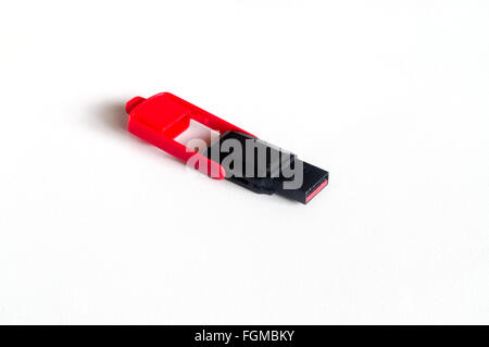Black usb flash drive with foldable red cap isolated on white background Stock Photo