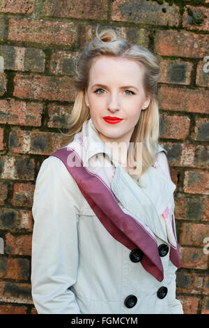 Young woman from the forties era looking straight to camera Stock Photo
