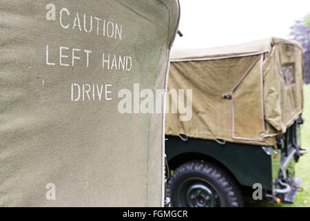 Caution Left Hand Drive notice on back of US Military jeep on display in UK Stock Photo