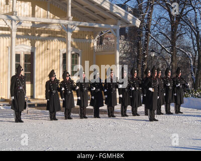 'Garden', the Norwegian Royal Guard lined up in warm winter uniforms outside their barracks in the palace park in Oslo Norway Stock Photo
