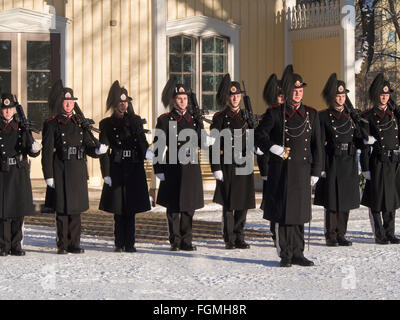 'Garden', the Norwegian Royal Guard lined up in warm winter uniforms outside their barracks in the palace park in Oslo Norway Stock Photo