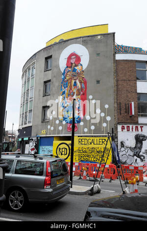 Roadworks and Japanese woman street art mural in Shoreditch London England UK  KATHY DEWITT Stock Photo