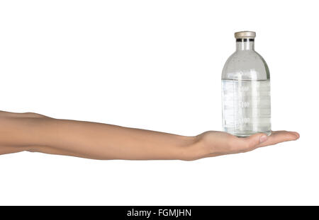 Close-up of female hand holding medical solution in a bottle Stock Photo