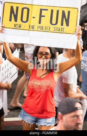 Sydney, Australia. 21st Feb, 2016. A marcher holds up a sign 'no fun NSW the police State'. © Richard Ashen/Pacific Press/Alamy Live News Stock Photo