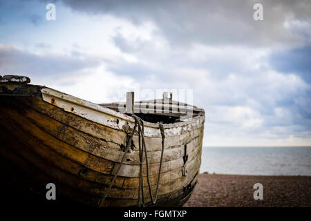 Old wooden fishing boat on Brighton beach,Sussex, UK Stock Photo