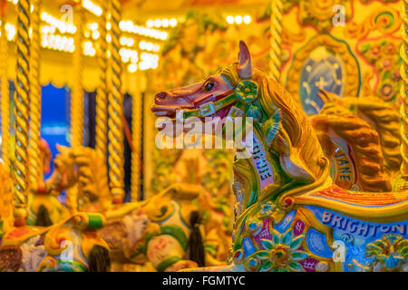 Illuminated Carousel merry go round horses on Brighton's Palace Pier, UK Stock Photo