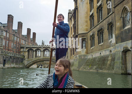 Punting on the river cam in Cambridge on a cold February day Stock Photo