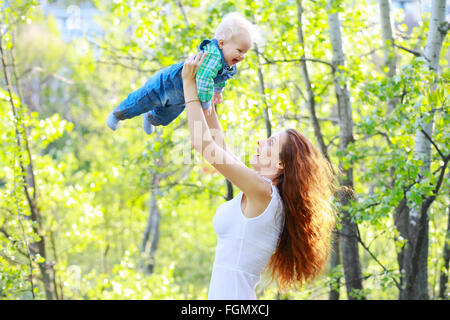 Mom playing with baby on outdoors Stock Photo